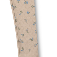 Beige pants with floral pattern on a white background