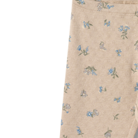 Beige pants with floral pattern on a white background