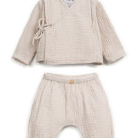 Beige baby outfit with top and pants on a white background