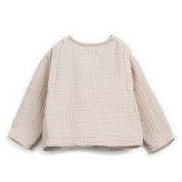 Beige textured sweater on a white background