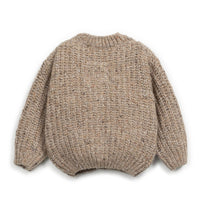 Knitted sweater with bunny ears on a white background
