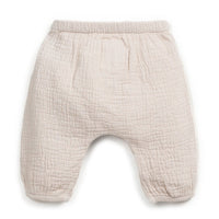 Beige baby pants on a white background