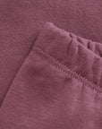 Close-up of a folded purple fabric with visible stitching