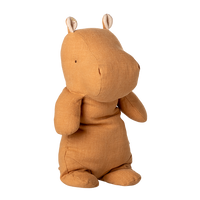 Brown plush toy with animal ears on a white background