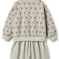Floral-patterned top and beige skirt set on a white background