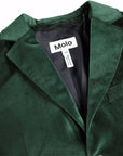 Close-up of a dark green velvet blazer jacket with a white brand label reading 'Molo' inside the collar, on a plain white background.