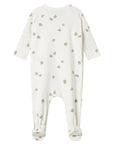 White baby onesie with small pattern on a white background