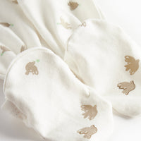 White fabric with gold dove prints on a white background