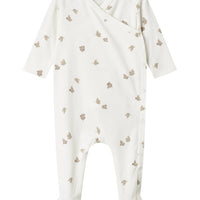 White baby onesie with small patterns on a white background