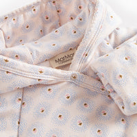 Baby outfit with floral pattern and 'Mama' label on a white background