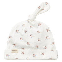 Floral-patterned baby hat with a soft texture on a white background