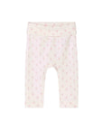 Baby leggings in a pale pink and cream color, featuring a small repeating pattern of pink bows and hearts, with an elastic waistband.