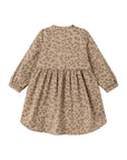 A long-sleeve children's dress with a gathered waist and an all-over leopard print pattern in beige and brown, shown from the back on a white background.