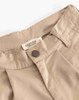 Close-up of a pair of beige trousers showing the waistband, belt loops, button closure, and a visible MarMat label.