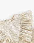 Beige dress with ruffled sleeves and a subtle pattern on a white background