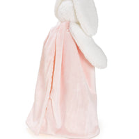 Pink and white plush blanket on a white background