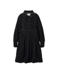 Black dress with a brand label on a white background