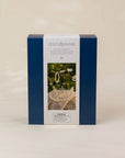 A square blue and white product box for Coco Village bead jewelry kits, featuring a photo of a pearl heart and jewelry on the front, set against a plain beige background.