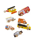 Set of colorful toy vehicles including an ambulance, fire truck, and others on a beige background