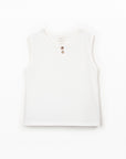 White sleeveless top with buttons on a white background