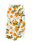 Fabric with orange and leaf pattern on a white background