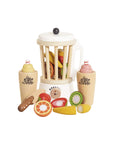 Wooden toy fruit set with a juicer on a white background
