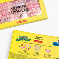 Super Smalls press-on nail kit packaging with yellow box and clear window