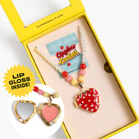 Colorful lip gloss set with heart-shaped mirror and strawberry design in a yellow box.