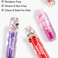 Super Snails lip balms in purple, red, and pink on a white background with safety certifications listed.