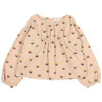 Beige blouse with floral pattern on a white background