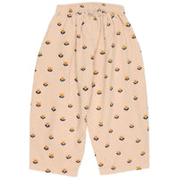 Beige pants with small pattern on a white background