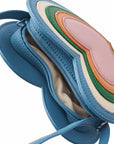 Blue handbag with a colorful interior on a white background