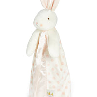 White bunny plush toy with a polka dot blanket on a white background