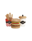 Wooden toy hamburger set with a cup labeled 'Soda' and fries container on a white background