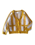 Yellow and white striped cardigan on a light gray background