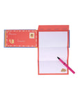 Notepad with pen and envelope on a white background