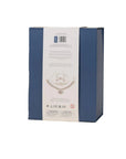 The back of a blue jewelry gift box with a white paper insert showing product details and a necklace illustration, photographed on a light beige background.