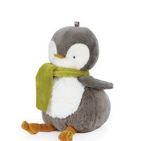 Plush penguin toy with a green scarf on a white background