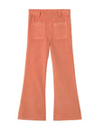 A pair of wide-leg trousers in a muted terracotta or burnt orange color, shown from the back with two back pockets and button details, laid flat on a light gray background.