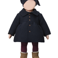 Doll wearing a dark coat, hat, and boots on a white background