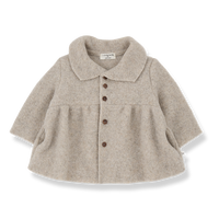Beige baby coat with buttons on a white background