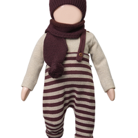 Doll wearing a striped outfit with a hat and scarf on a white background