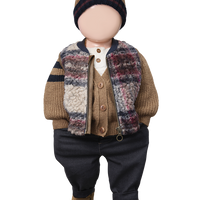 Doll wearing a plaid outfit with a hat on a white background