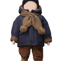 Doll wearing a navy coat, brown pants, and hat with a scarf on a white background