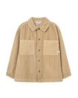 Beige corduroy shirt with two front pockets on a light gray background