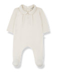 White baby onesie with a collar on a white background