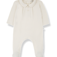 White baby onesie with a collar on a white background