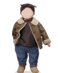 Doll wearing a brown coat, striped shirt, blue jeans, and brown boots on a white background