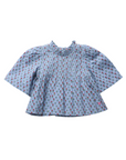 A light blue blouse with a dense red and white floral print, featuring a smocked high neckline and voluminous short sleeves, shown flat on a white background.