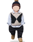 Child's outfit with a sweater vest, shirt, pants, and hat on a white background